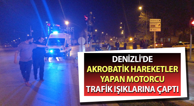 Akrobatik hareketler yapan motorcu trafik ışıklarına çaptı